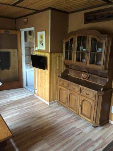 a kitchen with a wooden counter top in a room at cozy alpine house in Breitenstein
