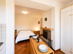 a bedroom with a bed and a table with plates on it at Casa Leima - Larihome A83 in Gera Lario