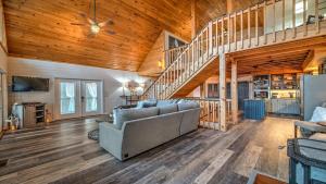 a living room with a couch and a staircase at Love Affair in Epworth