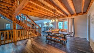 a dining room with a table and a staircase at Love Affair in Epworth