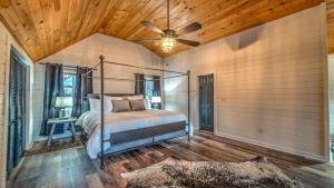 a bedroom with a bed and a ceiling fan at Love Affair in Epworth
