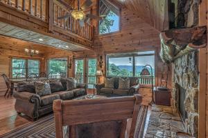 a living room with a couch and a fireplace at Black Bear Lodge in Blue Ridge