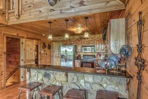 a kitchen with a large stone counter top in a cabin at Black Bear Lodge in Blue Ridge