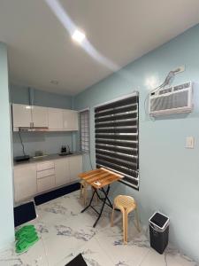 a small kitchen with a table and a fan at M&S Cabina in Alburquerque +21 photos