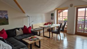 a living room with a couch and a table at Ferienwohnung Erhard in Schönberg
