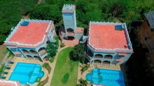 an aerial view of a house with a swimming pool at Diani Pearl in Diani Beach