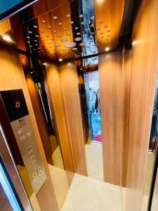 a row of wooden doors in a store at Hotel sagar inn in Ajmer