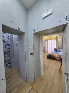 a bedroom with a bed and a room with a mirror at Maison de Ciro in Gragnano +35 photos