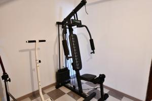 a room with a workout machine in the corner at Casa do Sol Wellness Home in Óbidos
