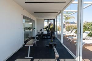 a gym with a machine on the floor of a building at Sublimare Luxury Apartments in Giulianova