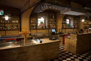 a bar with a counter in a room at Hotel Stork in Lednice