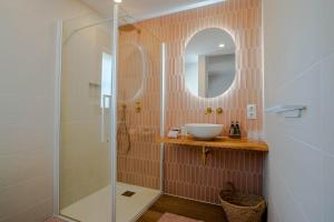 a bathroom with a sink and a shower at B&B Casa Mijo in Daimalos
