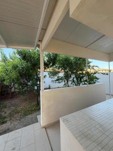 an empty house with a view of the water at Indie little house in Limassol