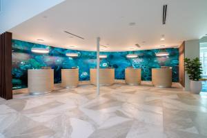 a lobby with a mural in the background at Captain's Quarters Resort in Myrtle Beach