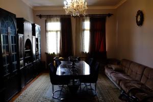 a living room with a table and a couch at Tsikhisdziri House 3 in Ts'ikhisdziri