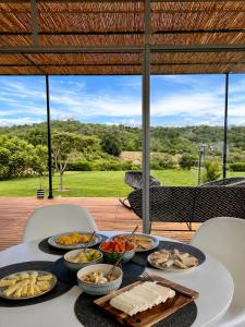 a table with many plates of food on it at Finca Samana in Tocaima