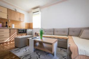 a living room with a couch and a coffee table at Markovi A&V in Gevgelija