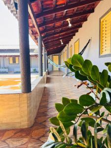 an external view of a house with a wooden ceiling at WS Hotel in Campo Alegre