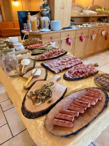 a table with many different types of food on it at Agritur Casamela in Taio