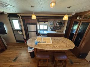 a kitchen with a sink and a counter in an rv at Florida VIBE in Homosassa Springs