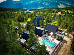 an aerial view of a resort with a swimming pool at Natural Dream Blidinje in Rudo Polje