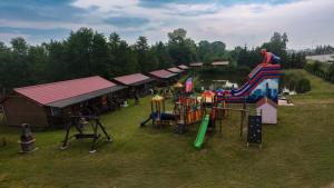 an aerial view of a park with a playground at Domki u Czopera in Zełwągi