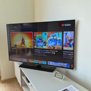 a flat screen tv sitting on top of a table at Kastani Home 15 in Tartu