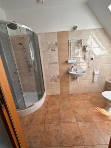 a bathroom with a shower and a sink at U Górala in Cieszków +23 photos