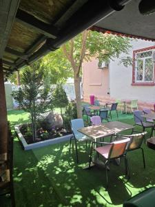 a group of tables and chairs on a patio at Sinziana Eforie Sud in Eforie Sud