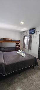 a bedroom with a bed with towels on it at new bv carlos paz in Villa Carlos Paz +45 photos