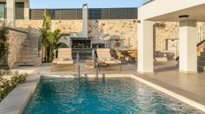 a swimming pool in the middle of a house at Sunset Dream Luxury Villa in Keri