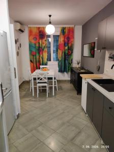 a kitchen with a table and a dining room at Ksandra in Topla