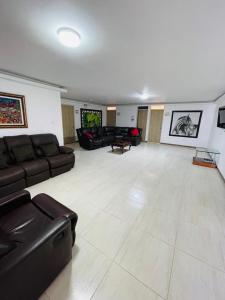a large living room with couches and a couch at hotel boutique in Pereira