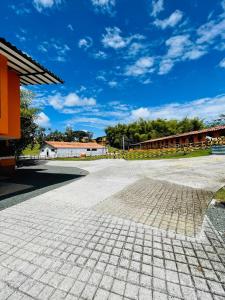 an empty parking lot in front of a building at hotel boutique in Pereira