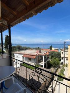 a balcony with a view of the ocean at Avgoustina Venus Studios in Benitses