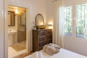 a bathroom with a shower and a sink and a mirror at Villa Can Gavarres in Bell-Lloch +34 photos
