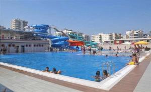 a pool on a cruise ship with people in it at Now Boutique Hotel in Erdemli