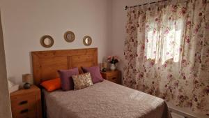 a bedroom with a bed and a window at Casas Hoya Limpia- Sólo Adultos in Santa Cruz de la Palma +46 photos