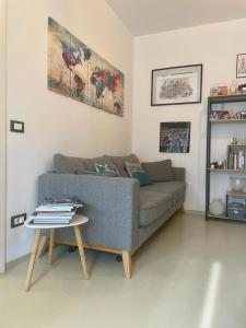 a living room with a couch and a table at Fabio's Home in Bassano del Grappa