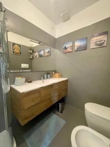 a bathroom with a sink and a toilet at Fabio's Home in Bassano del Grappa +27 photos