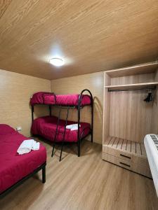 a small room with two bunk beds in it at Chalet - Snow Village Roccaraso in Roccaraso