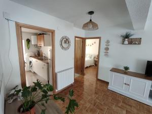 a large room with a kitchen and a room with a kitchen at Casa Manito in El Barraco