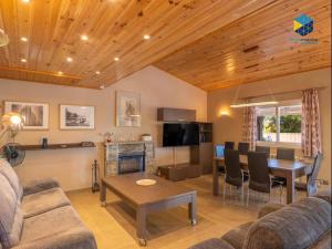 a living room with a couch and a dining room at Casa Bon Nadal in Llucmajor