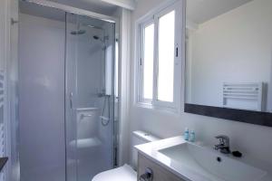 a bathroom with a shower and a sink and a toilet at Tamarit Beach Resort in Tarragona
