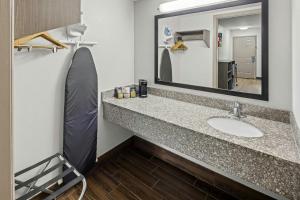 a bathroom with a sink and a mirror at Red Roof Inn & Suites Marysville in Marysville +18 photos