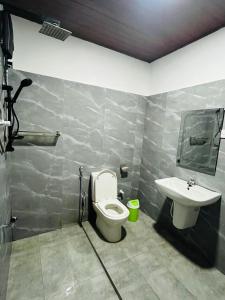 a bathroom with a toilet and a sink at Airport Kiyas Transit Villa Free Airport Pickup or Drop in Katunayaka