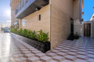 a lobby of a building with a tile floor at wend house in Jeddah