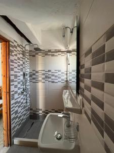 a bathroom with a sink and a bath tub at Avgoustina Venus Studios in Benitses +56 photos