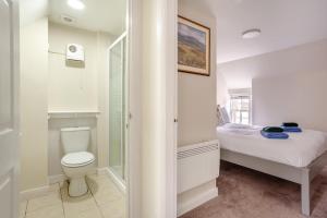 a bathroom with a bed and a toilet and a shower at 3 Bed in Dornoch oc-o44869 in Dornoch +21 photos