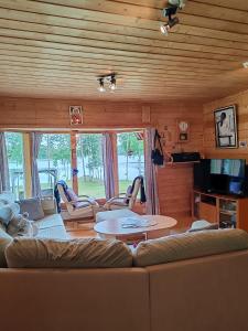 a living room with a couch and a table at Villa Niki in Telataipale